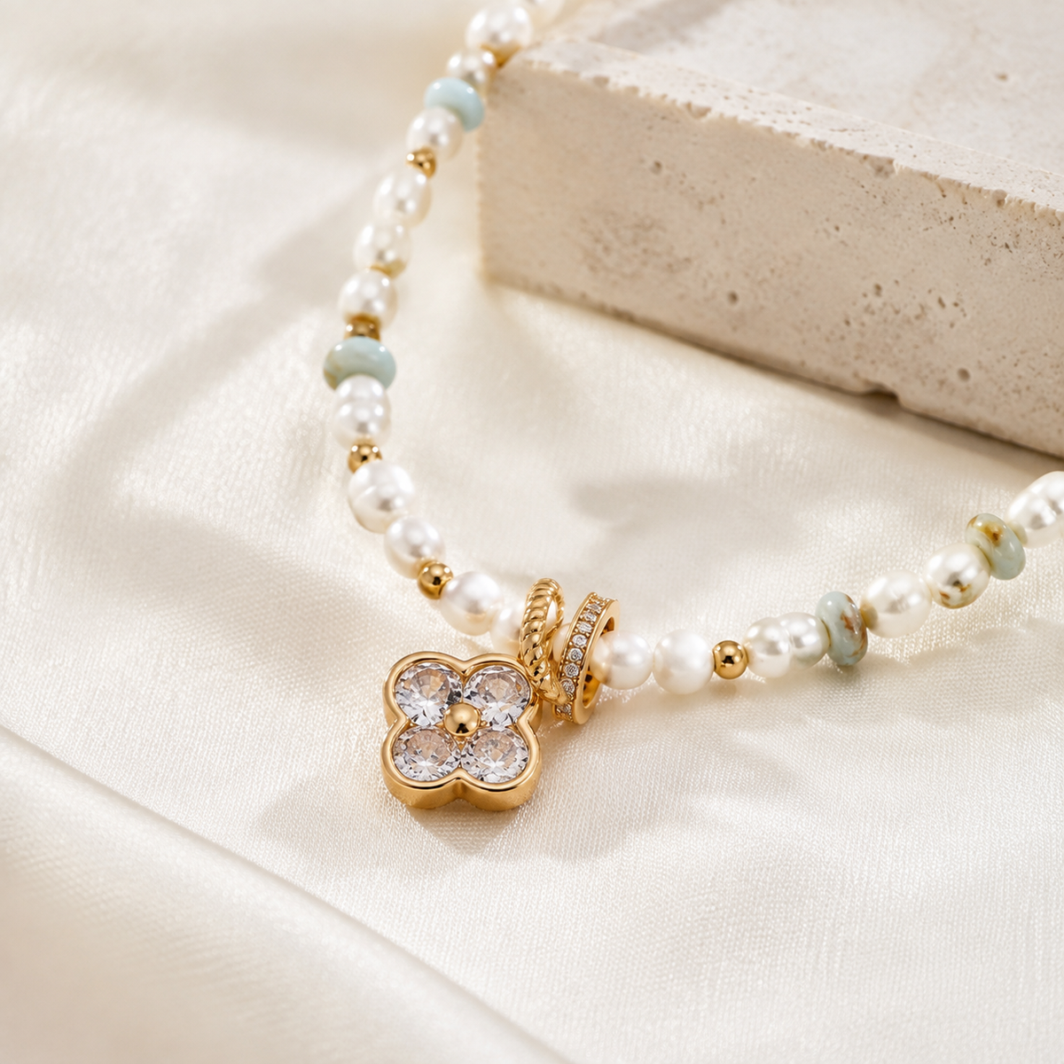 Close product view of the Four Blessings clover pendant with pearls and Shoushan stone beads