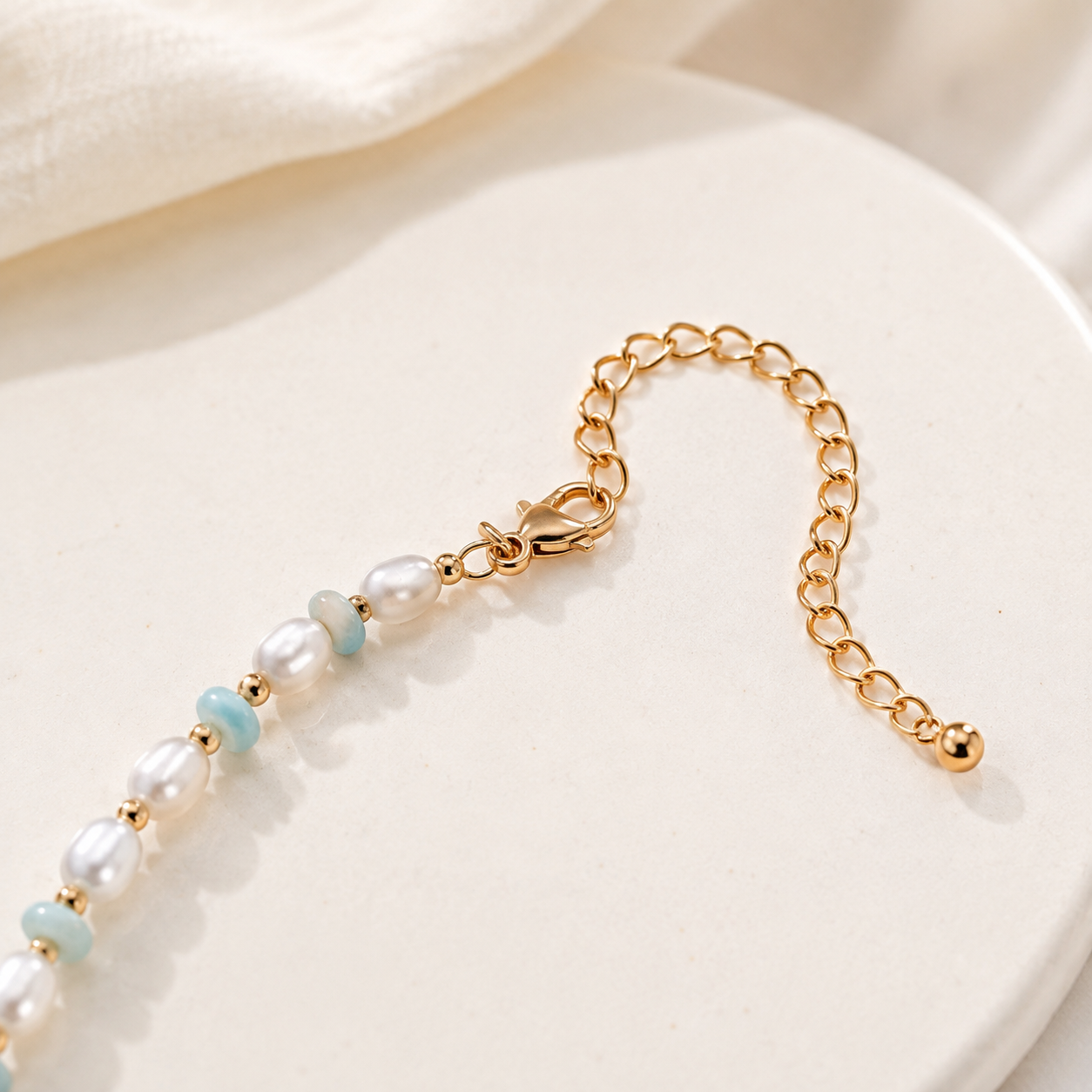 Close view of the Vintage Gold necklace clasp and extender chain