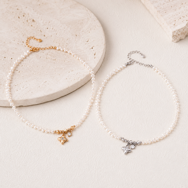 Vintage Gold and Silver celestial natural pearl charm necklaces shown together