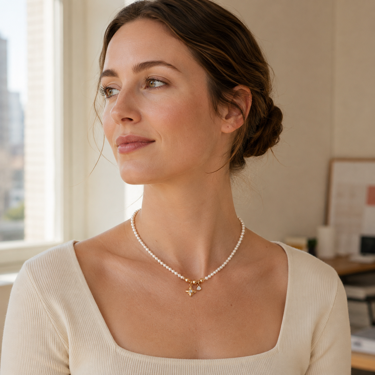 Model wearing Vintage Gold celestial natural pearl charm necklace