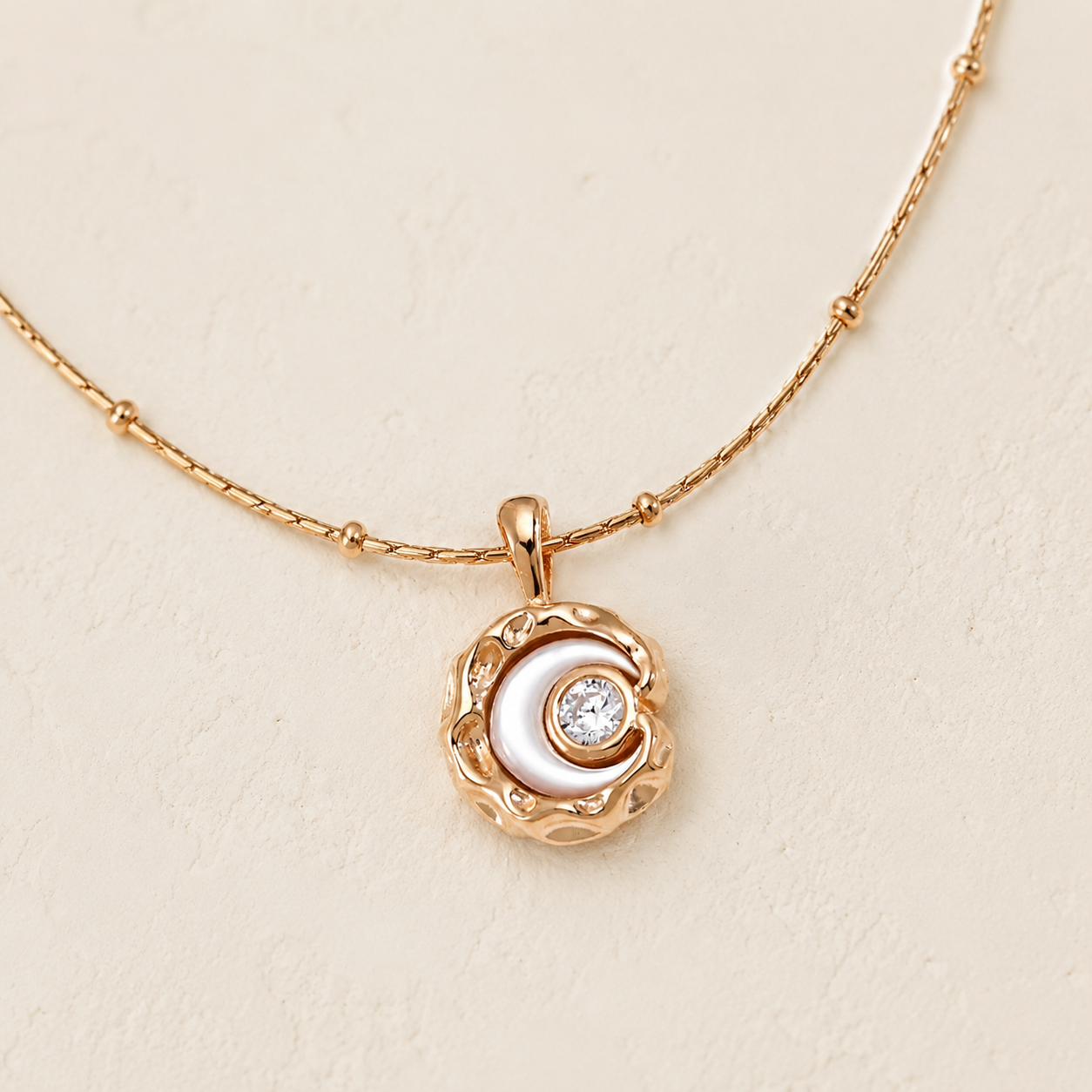 Close-up of the Vintage Gold mother-of-pearl moon pendant with cubic zirconia