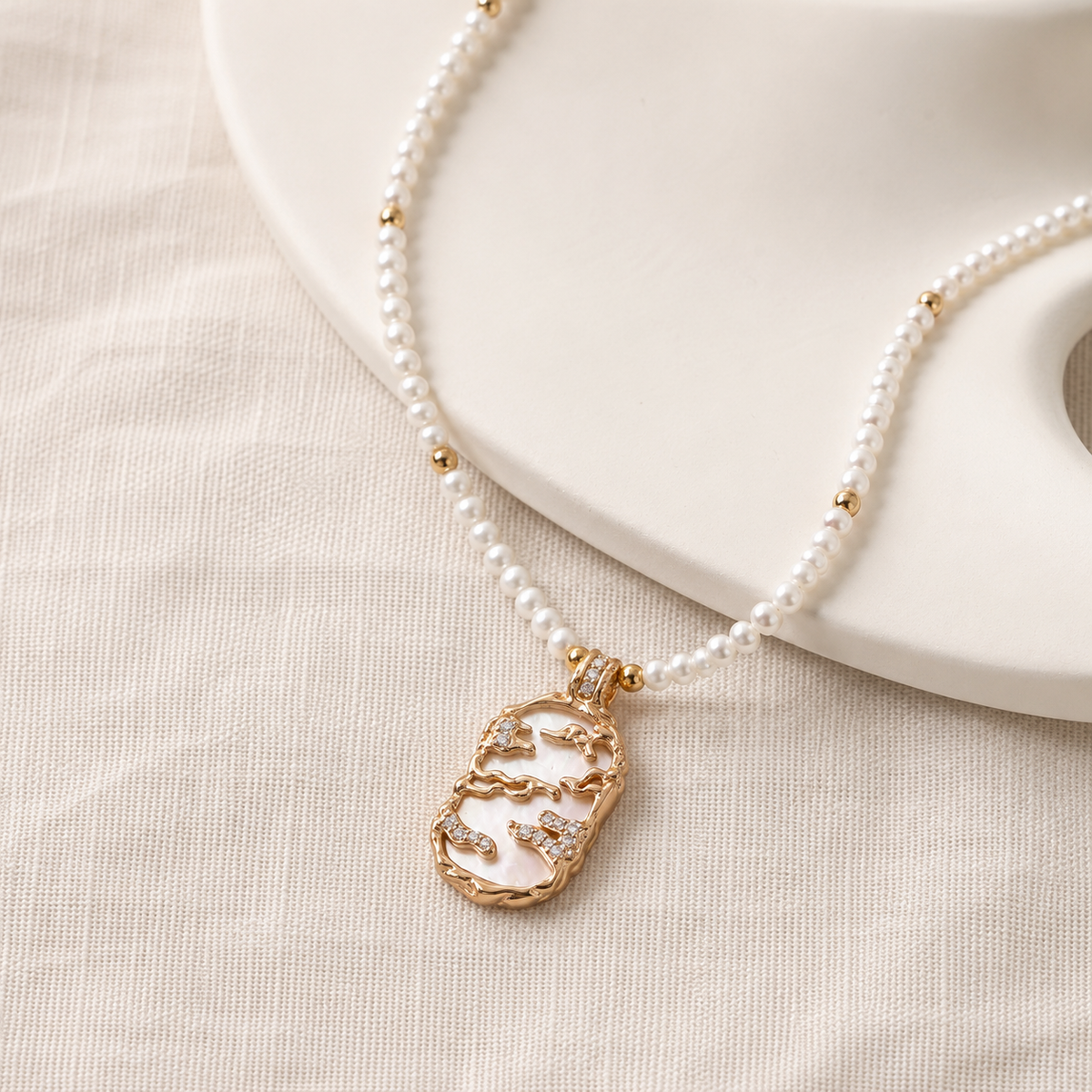 Full view of the Vintage Gold mother-of-pearl pendant necklace with a natural pearl strand