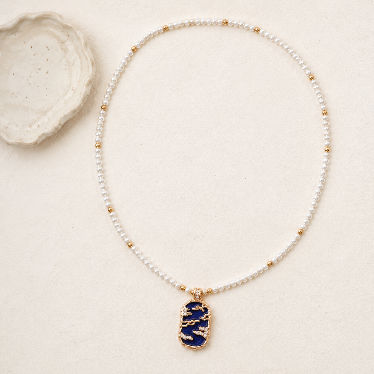 Full view of the Vintage Gold lapis lazuli pendant necklace with a natural pearl strand