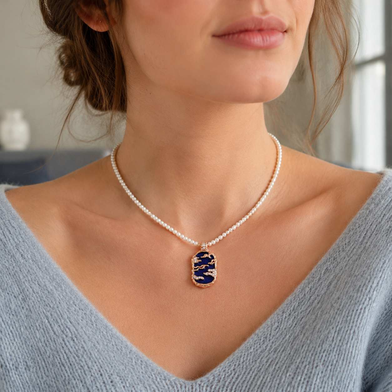 Close neckline view of the Vintage Gold lapis lazuli pendant necklace with a natural pearl strand
