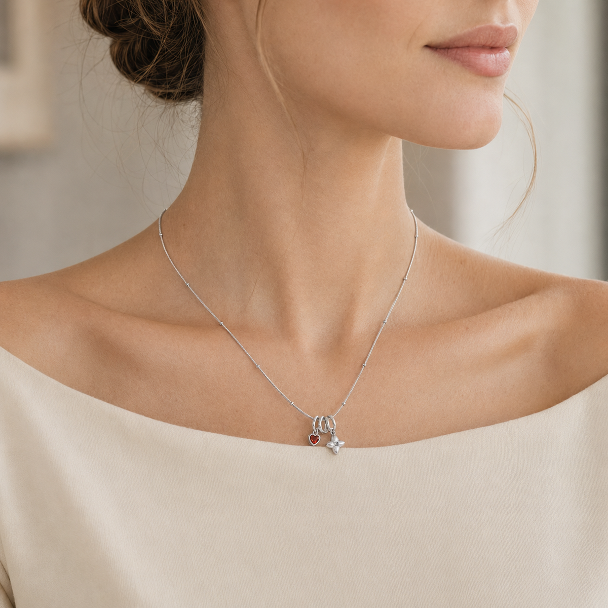 Woman wearing Silver zircon layered charm necklace