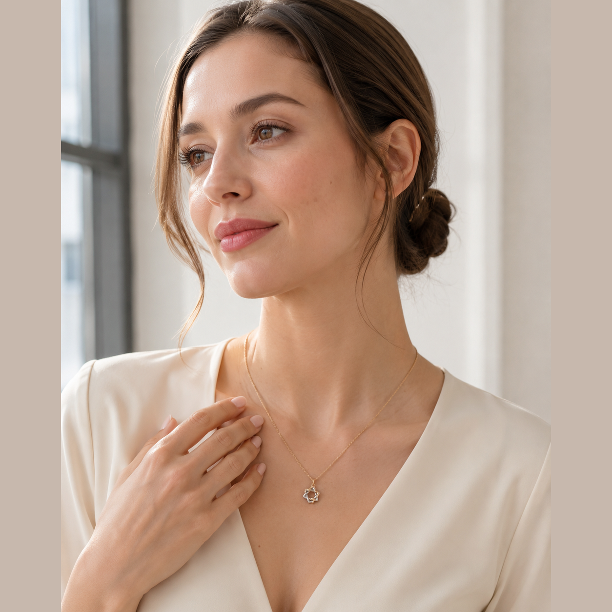 Model styling the mixed-tone Interwoven Star Pendant Necklace at the collarbone