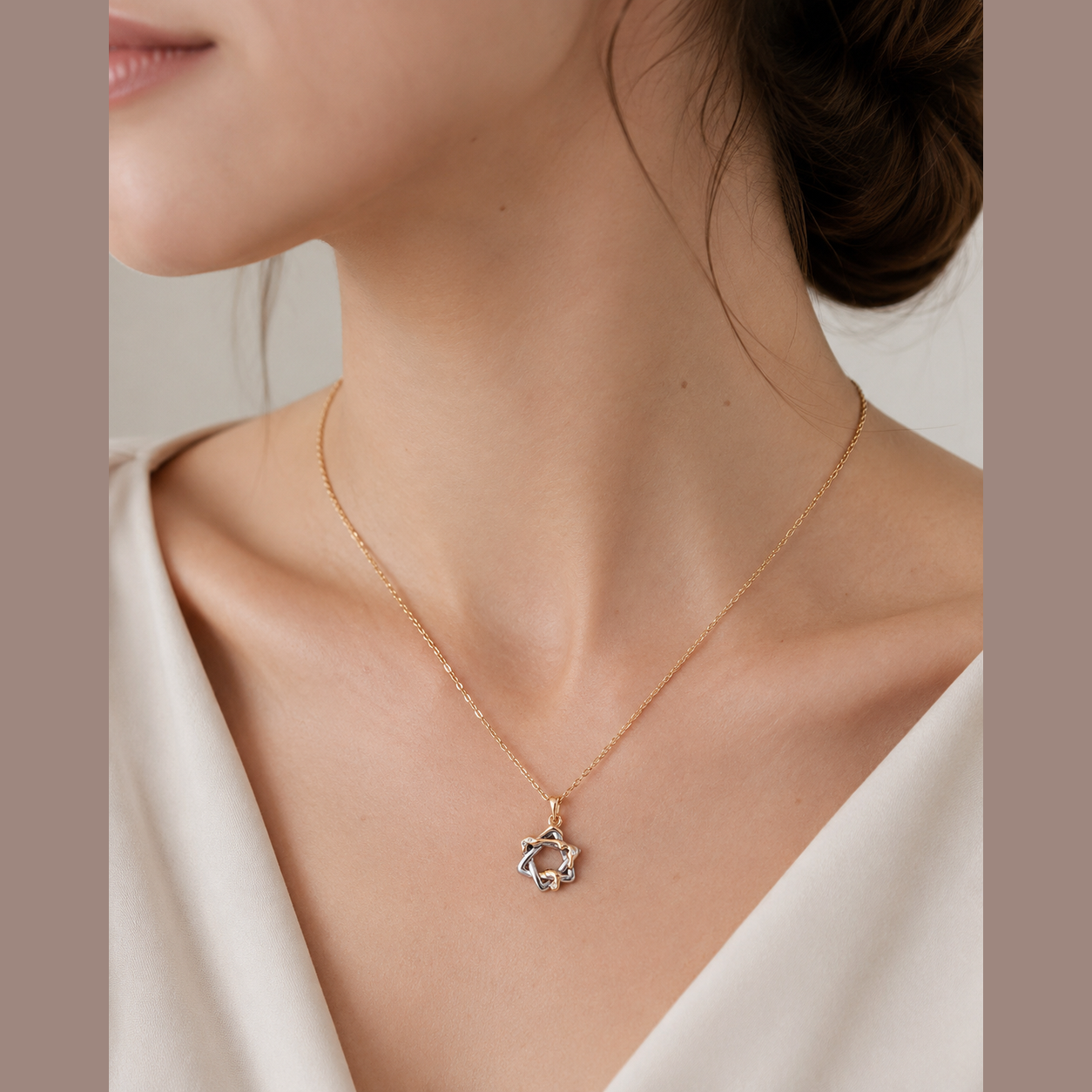 Close neckline view of the Vintage Gold Interwoven Star Pendant Necklace