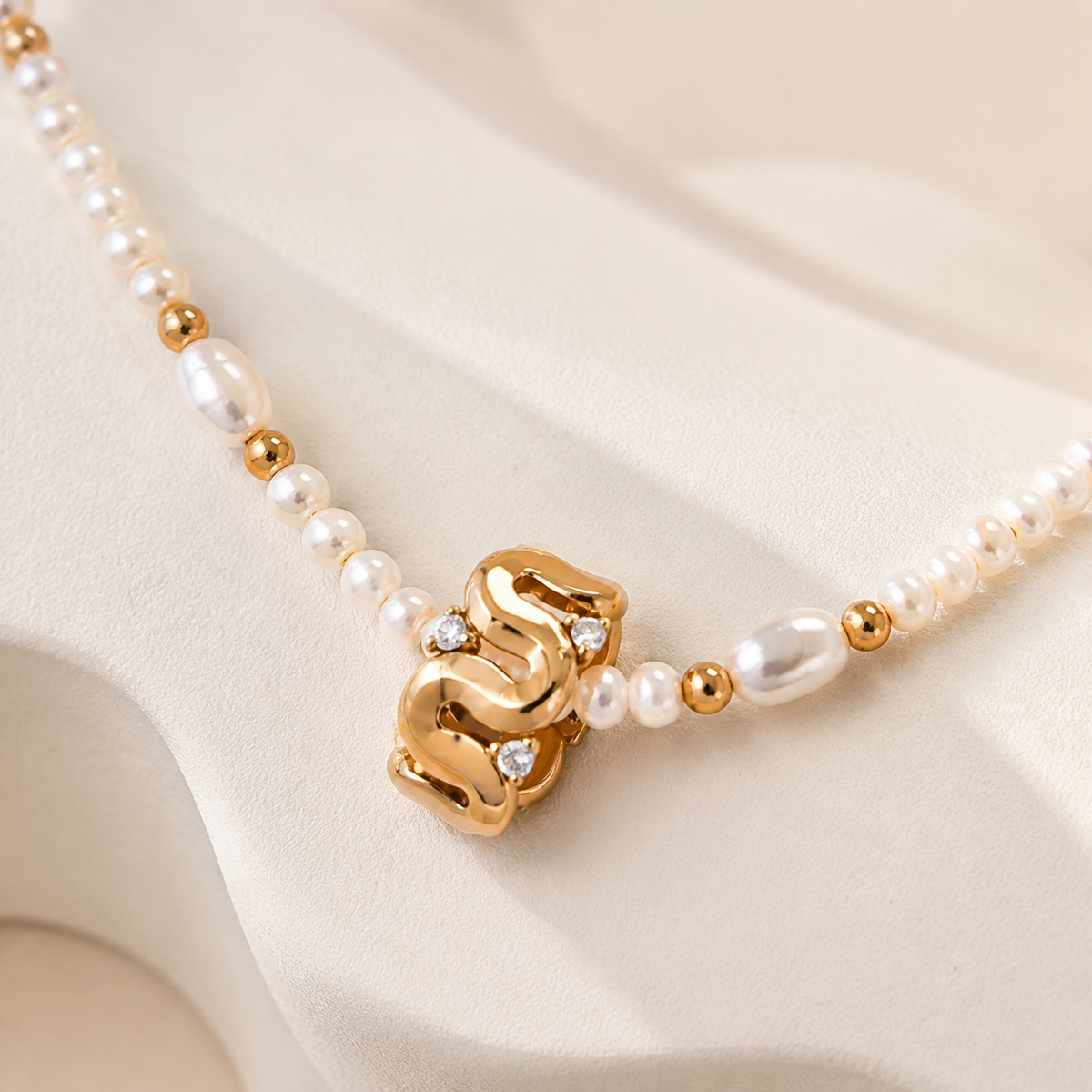 Close view of Vintage Gold sculpted natural pearl zircon necklace