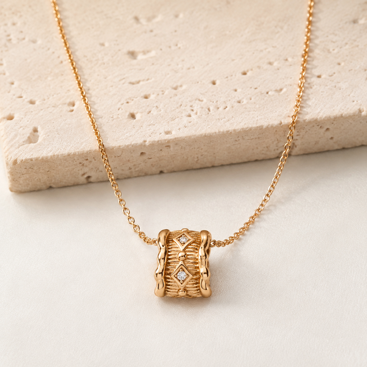 Vintage Gold Vintage Zircon Pendant Necklace on an ivory display