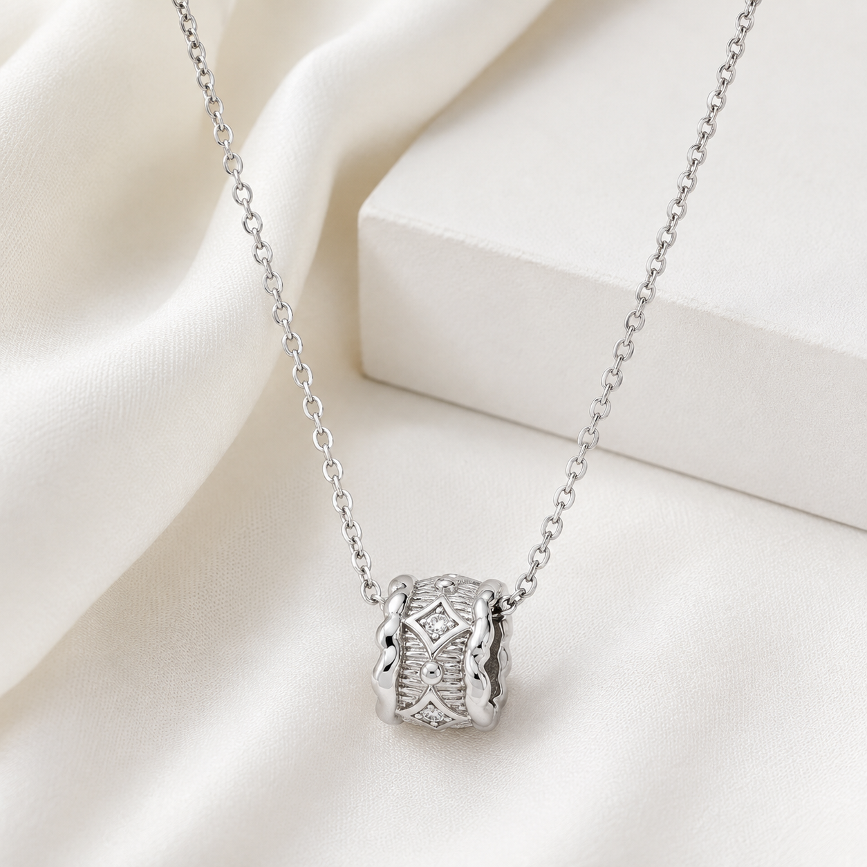 Silver Vintage Zircon Pendant Necklace on ivory satin