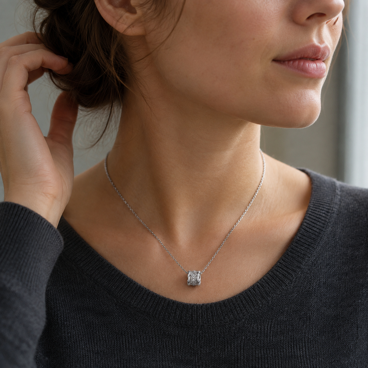 Close neck view of a model wearing Silver Vintage Zircon Pendant Necklace