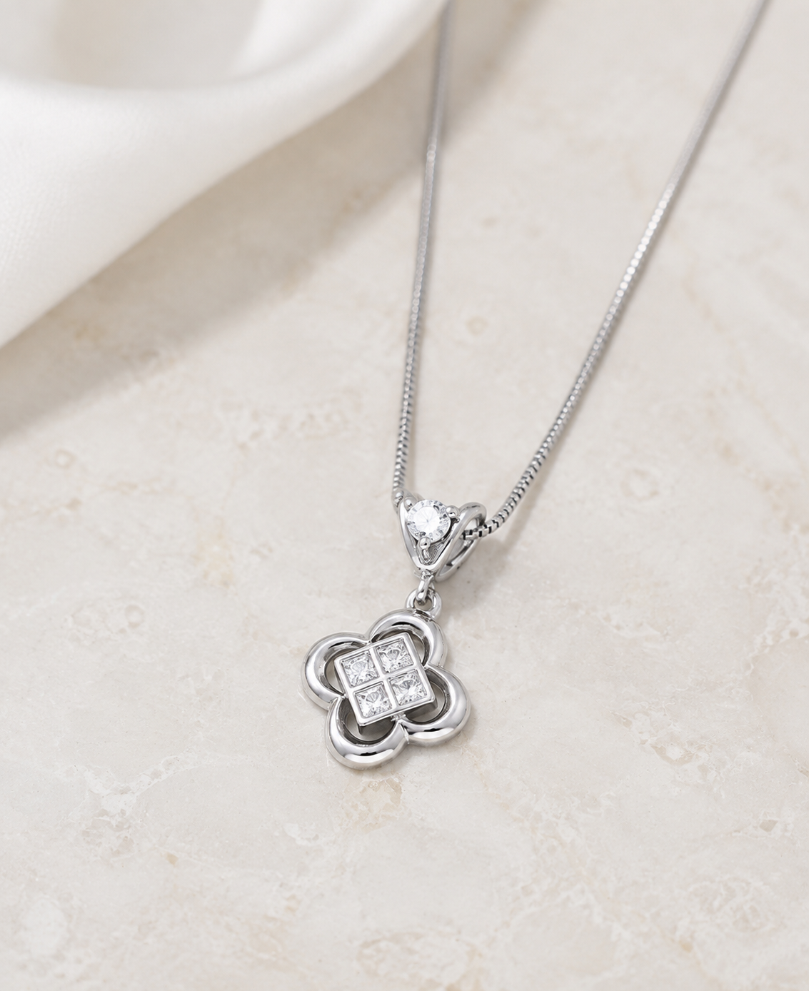 Silver clover zircon pendant close-up