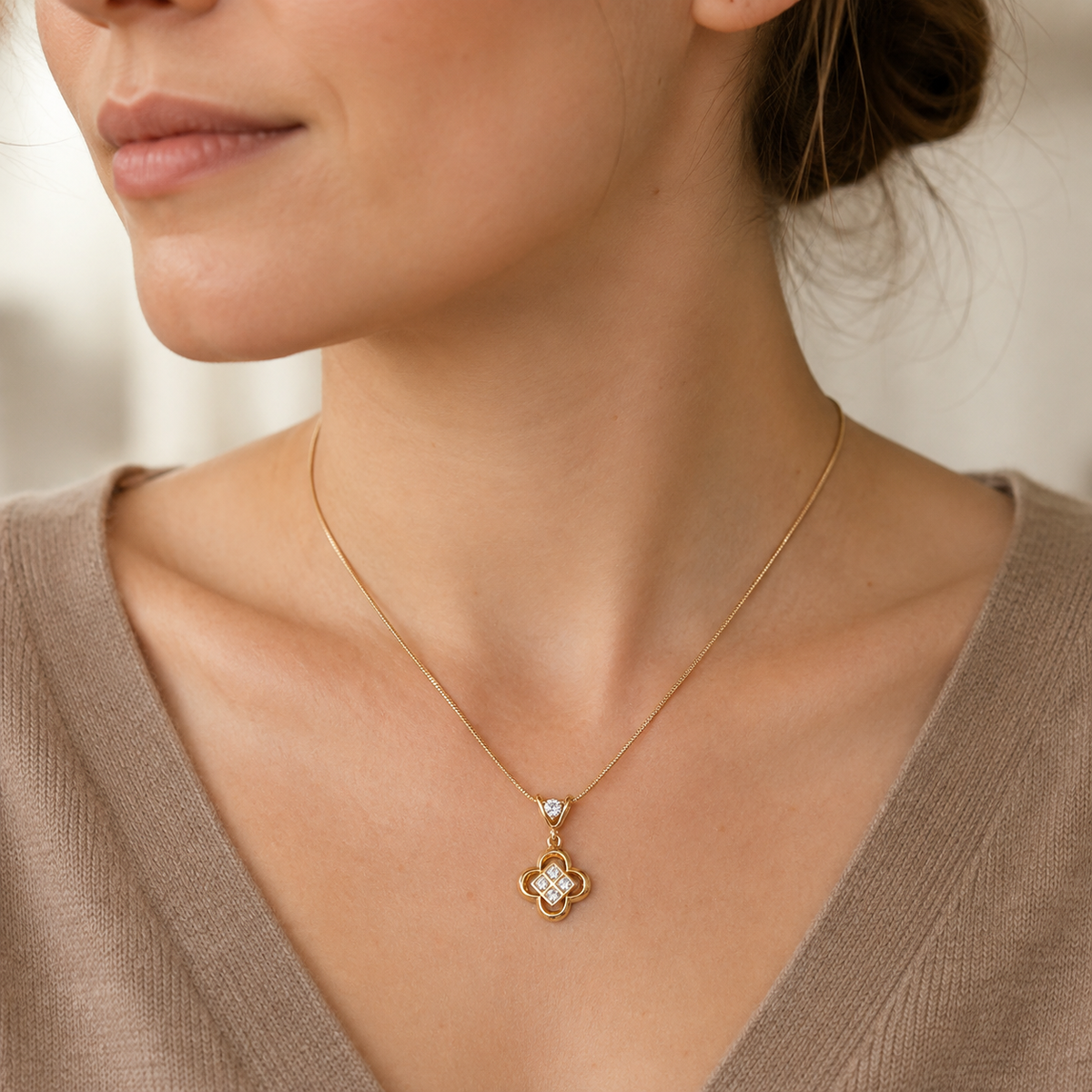 Close-up of model wearing Vintage Gold clover zircon pendant necklace