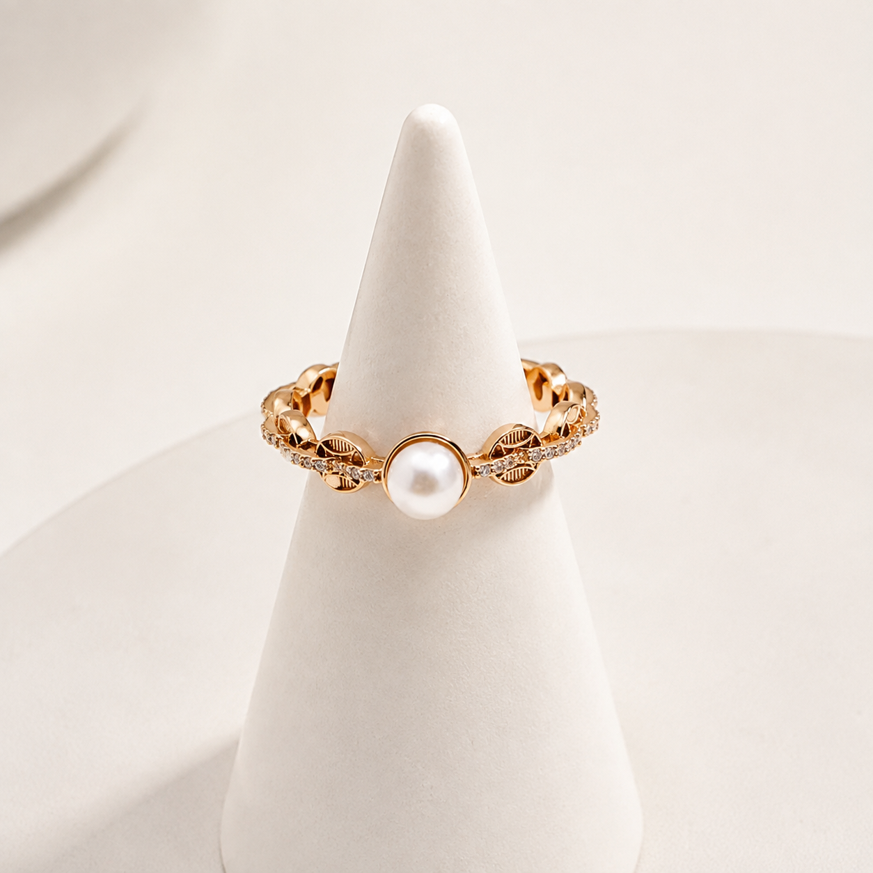 Vintage Gold pearl coin motif ring on a ring stand
