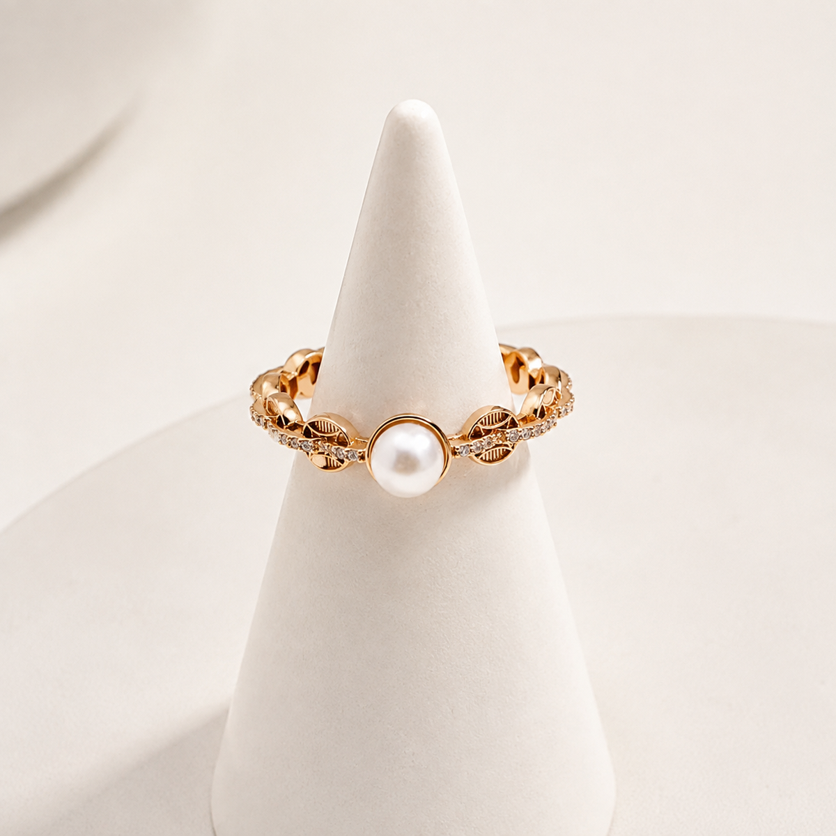 Vintage Gold pearl coin motif ring on a ring stand