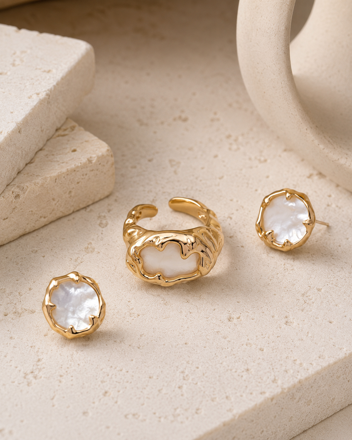 Mother of pearl ring coordinated with matching stud earrings