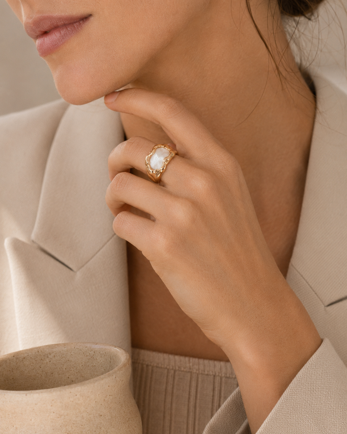 Close-up lifestyle view of sculptural mother of pearl ring