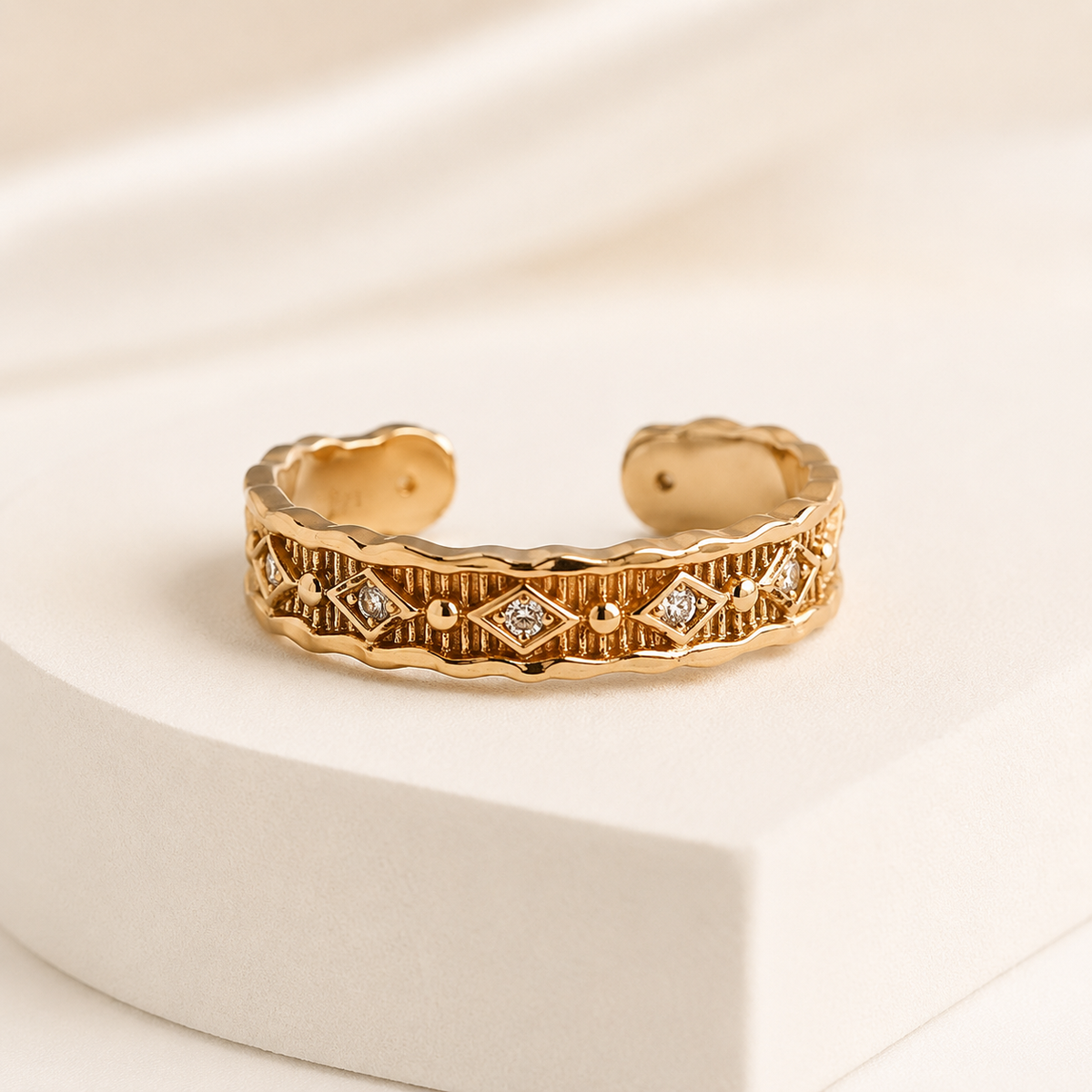 Vintage Gold Vintage Zircon Ring on an ivory display