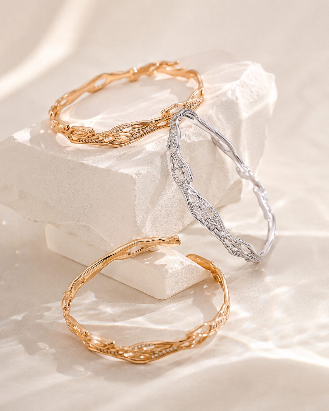Vintage Gold and Silver adjustable zircon bangles in an editorial arrangement