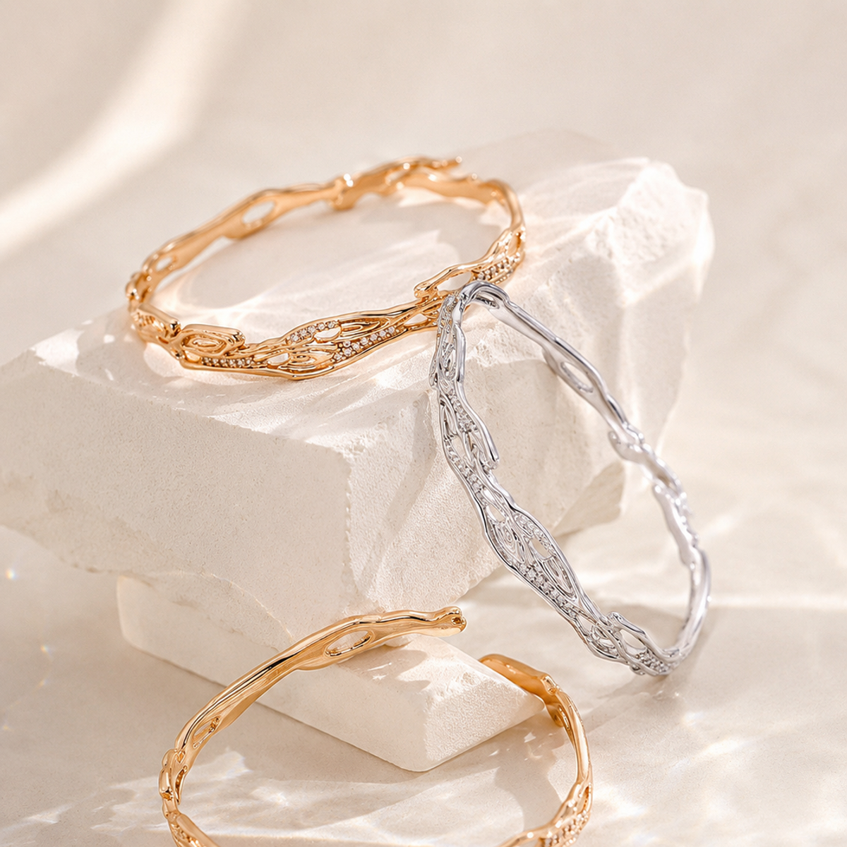 Vintage Gold and Silver adjustable zircon bangles in an editorial arrangement